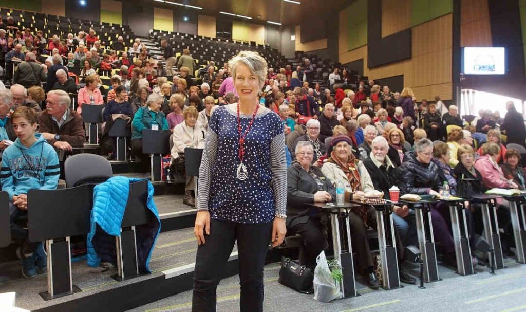 woman standing in front of audience