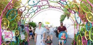 bike arch with happy family walking through
